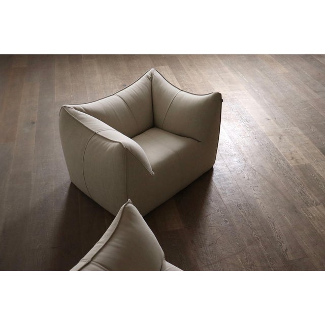 Beautiful le bambole sofa and lounge chair in original beige linen upholstery, designed by mario bellini for b&b italia in...