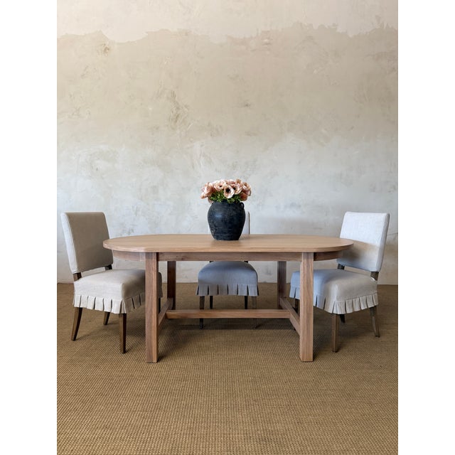 Introducing our exquisite Amber oval dining table, crafted from beautiful white oak for a touch of elegance. Its solid...