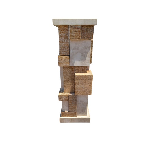 Vintage post modern tesselated pedestal. The pedestal has varying size cubes that are tesselated stacked up . Marquis of...