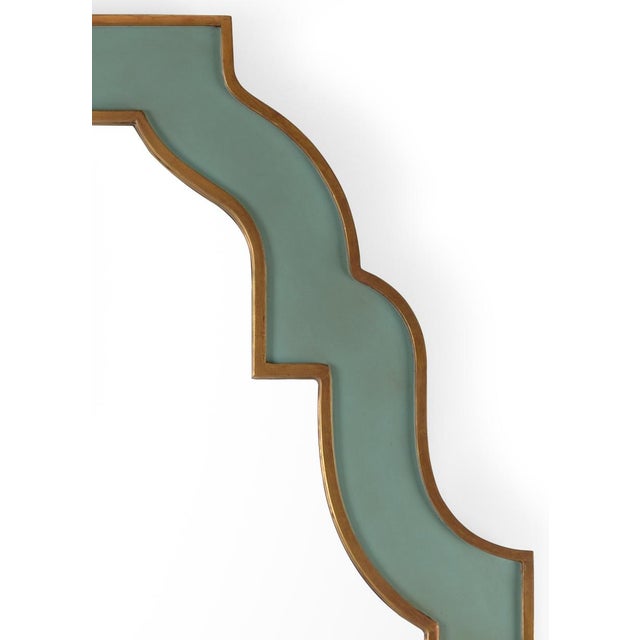 Antique mint green painted wood with antique gold leaf edges and plain clear mirror, designed by Bradshaw Orrell.