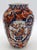 Circa 1860-80 Japanese Meiji period Imari vase. Ribbed body elegantly decorated with reserves of a jardiniere overflowing...
