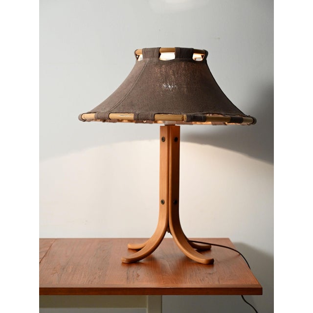 "Anna" table lamp by Anna Ehrner for Ateljé Lyktan. Made of curved oak with a raw fabric shade. "Anna" table lamp by Anna...