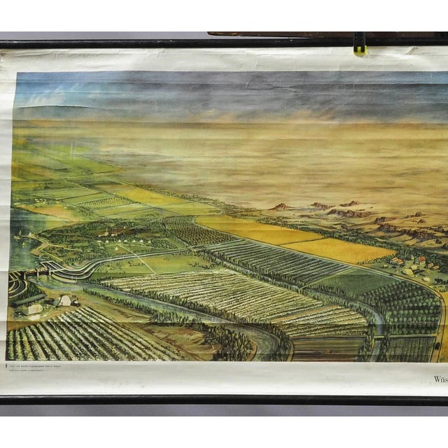 An impressive countrycore pull-down wallchart landscape format showing a beautiful river oasis scenery inside a desert of...