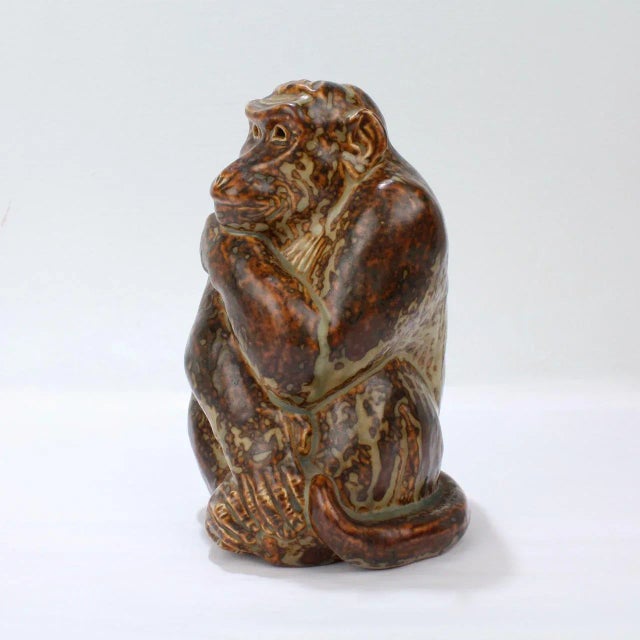 A wonderful stoneware pottery model of a Monkey designed by Knud Khyn for Royal Copenhagen. Knud Khyn (1880-1969) was a...