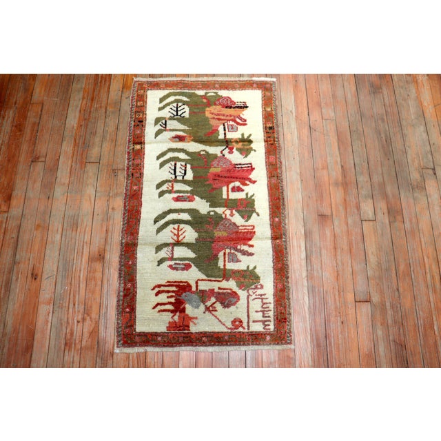 an early 20th Century Turkish rug with a pictorial camel animal design Details rug no. r5498 size 2' 1" x 3' 8" (64 x 112 cm)