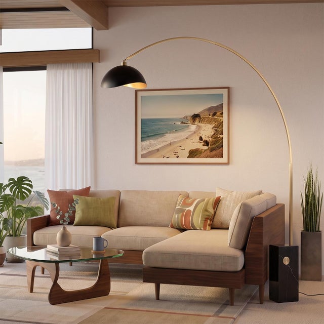 Weathered brass paired with a black marble base defines the Iconic Arc Lamp, a Mid-Century Modern statement piece designed...