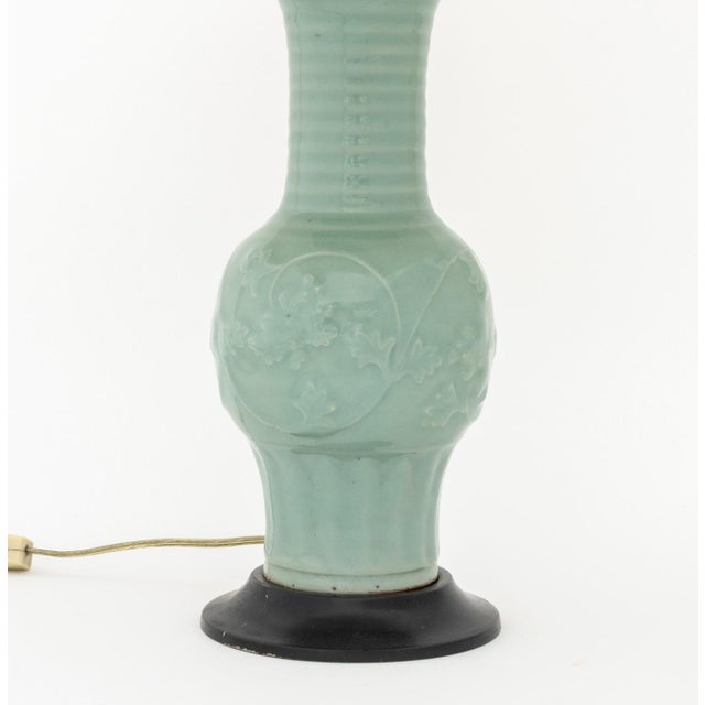 Chinese Celadon Glazed Ceramic Vase Mounted as a Table Lamp, the vessel of Phoenix Tail vase form with molded scrolling...
