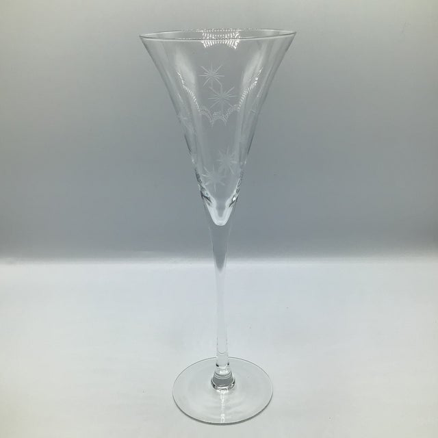 Set of tall Waterford star etched crystal champagne toasting flutes.
