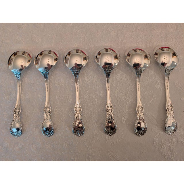 Sterling silver cream soup spoons in the popular "Burgundy" pattern by Reed & Barton. This pattern allows the spoon to fit...
