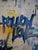 Fun, graffiti-style painting on canvas by Amber Goldhammer. Measurements are 24"w x 24"h x 1.5"d. Sides are painted a...