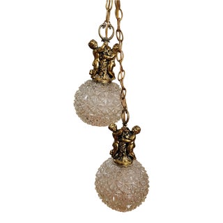 Mid 20th Century Hollywood Regency Fredrick Ramond Double Swag Pendant Light With Brass Cherubs & Cut Glass Globes For Sale