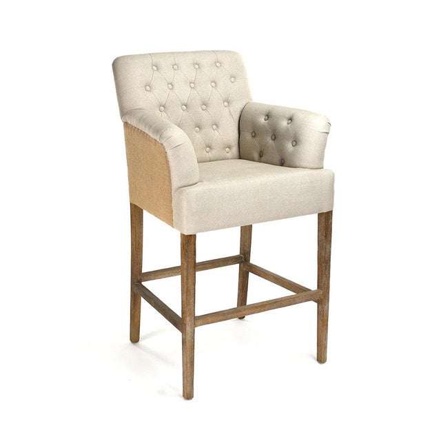 The Barrois Bar Stool from Zentique is a French country tufted bar stool with a diamond-tufted natural linen front and...