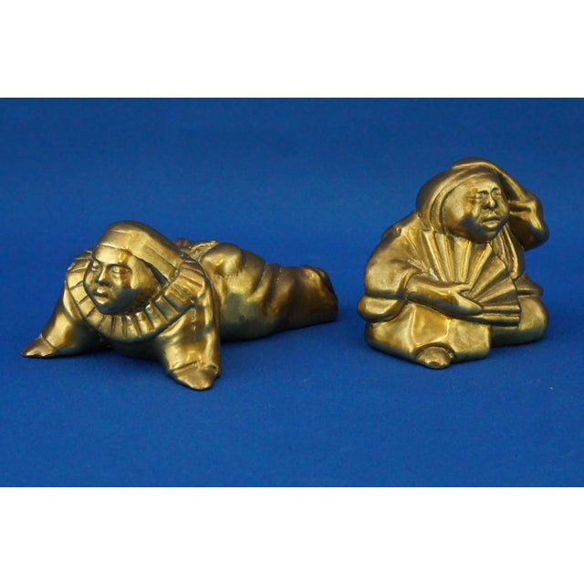 Measurements: reclining man sculpture: height: 5 cm; width: 7.5 cm; depth: 12.5 cm; seated man sculpture: height: 6.8 cm;...