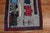 A 20th century pictorial rug with trains on a gray ground. The border has the exact date the rug was completed, the area,...