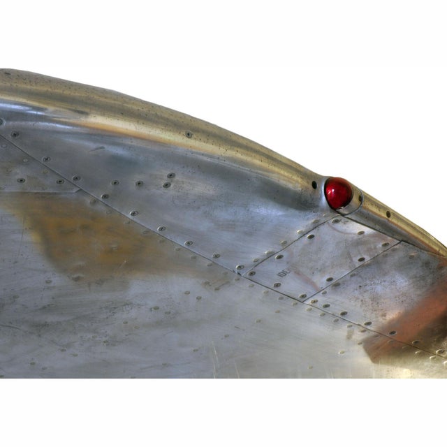An authentic mid-20th-century polished aircraft wingtip serves as a remarkable statement piece, adding a touch of...