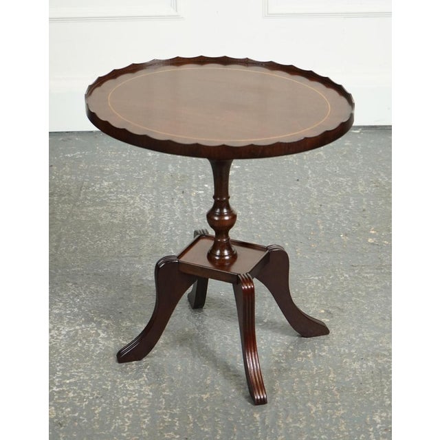 Flamed hardwood oval pie crust side table is a stylish and elegant piece of furniture typically crafted from high-quality...