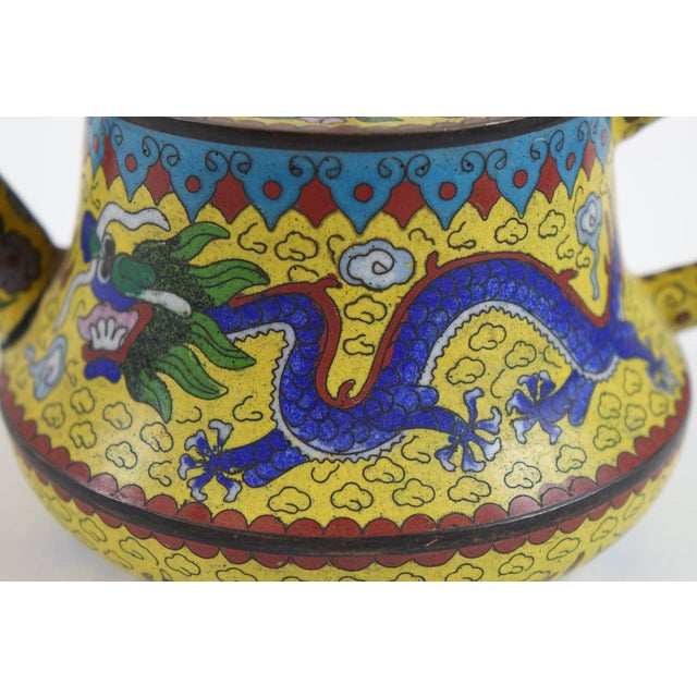 This is an Antique Chinese Cloisonné Decorative Teapot, measuring 7” x 5” x 3.5”, showcasing intricate craftsmanship with...