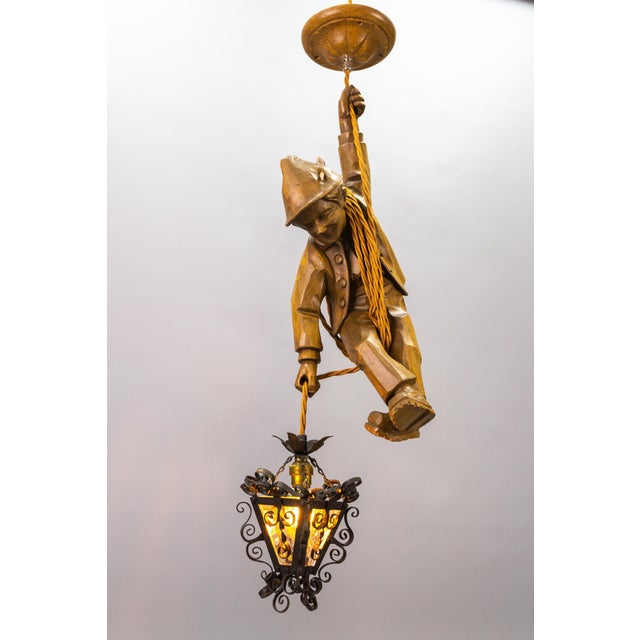 This adorable German figural pendant lamp from the circa 1950s features a hand-carved figure of a smiling mountain...