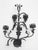 With its commanding silhouette and rich, dark patina, this mid-century Spanish Baroque-style wrought iron 5-light candle...