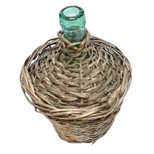 Small antique basket covered green glass wine bottle. No maker's marks.