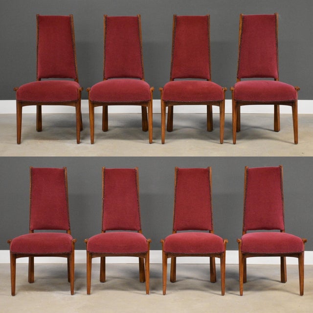 A set of eight custom mid century modern oak dining chairs by Pere Cosp with eloquently intentional twisted back rails....