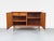 Teak sideboard with two handleless cabinet doors featuring solid wood edges. Beautiful grain and high-quality...