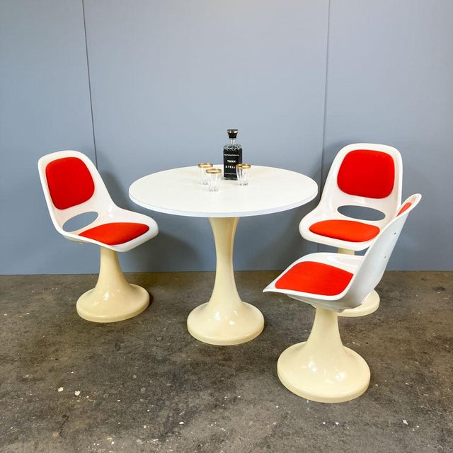 An original set from the 1970s, consisting of three tulip chairs and a matching table. Manufactured by lockhausen...