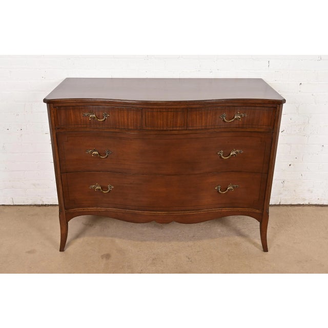 A gorgeous French Provincial Louis XV style three-drawer dresser or chest of drawers By White Furniture USA, Circa 1960s...