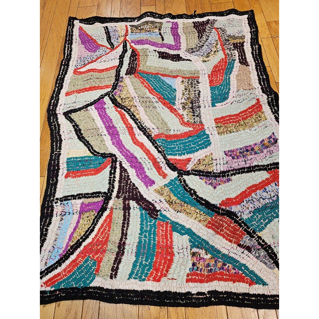 This striking vintage Moroccan Boucherouite rug stands apart from its counterparts through its unusually painterly quality...