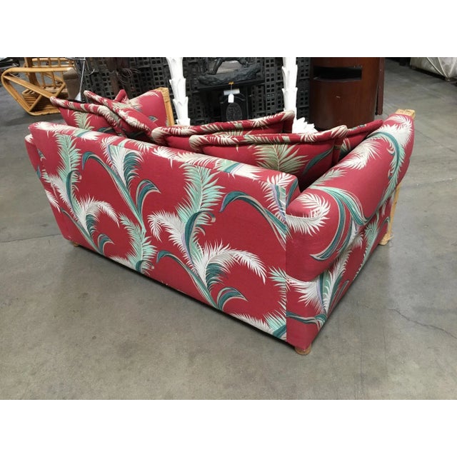 Discover luxury in the form of a rare pair of restored "Big Kings" plush rattan loveseat sofas. These exquisite pieces...