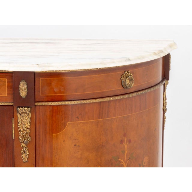 French Empire Style Marble Top Mahogany Sideboard, with burl walnut and marquetry inlay and brass mounts, with three...