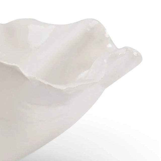 Enhance your modern home with freeform bowl. This hand glazed white Italian ceramic bowl has a freeform shape that...