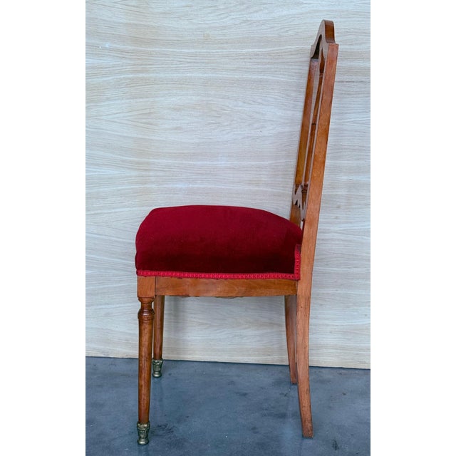 Late Victorian Oak Dining Side Chair. Features a ladderback and velvet seat. Supports are turned and ribbed.