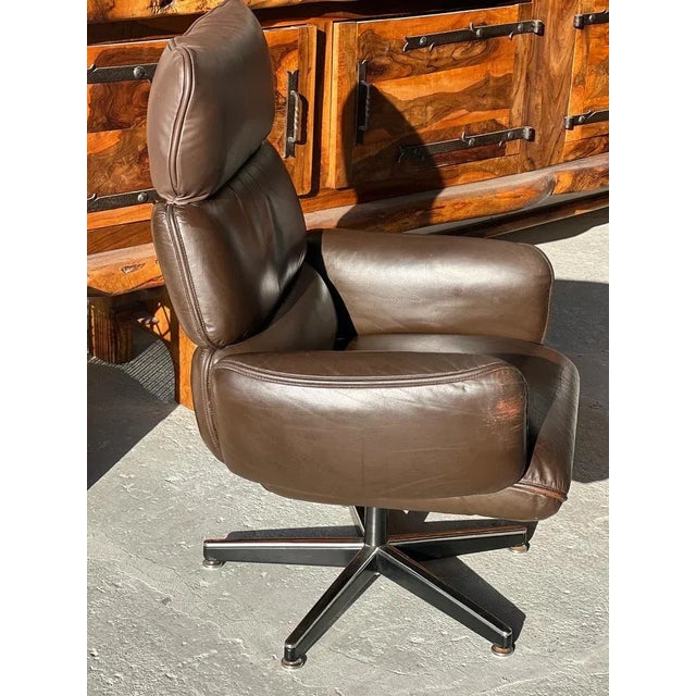 Brown leather office chair with swivel and tilt mechanism and headrest, by Otto Zapf for Knoll. American origin, circa...