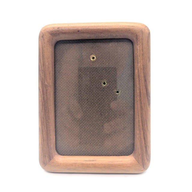 Offered is a vintage 1970s lathed Teak wood rectangular 3.5" x 5" photo frame with bull-nosed corners. It comes with its...