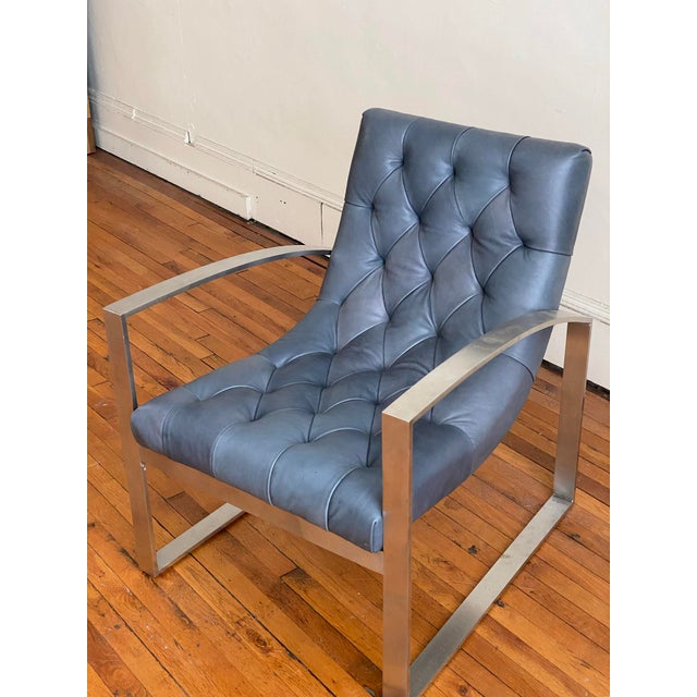 Modern Leather Accent or Club Chair with supple indigo leather balanced with sturdy metal arms and frame. Very comfortable...
