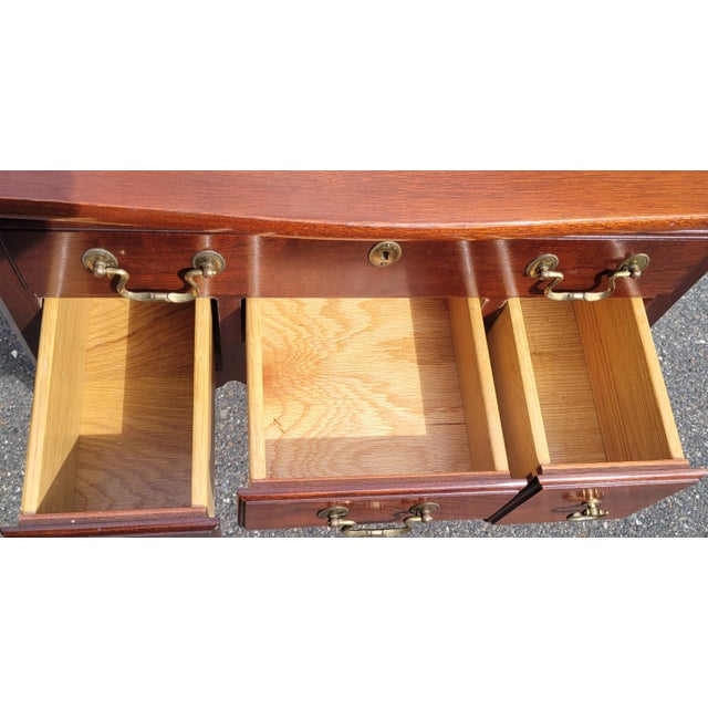 Beautiful pair of shell carved Chippendale end tables or nightstands by Link Taylor. Each features four drawers clean claw...