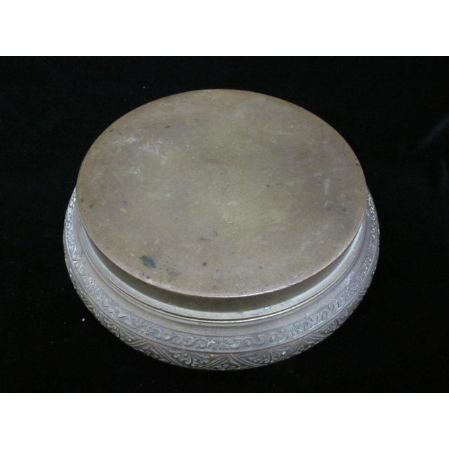 Antique, 19th century large brass bowl with lid. Lid can be placed downward as a covering or upward to be used as a base...