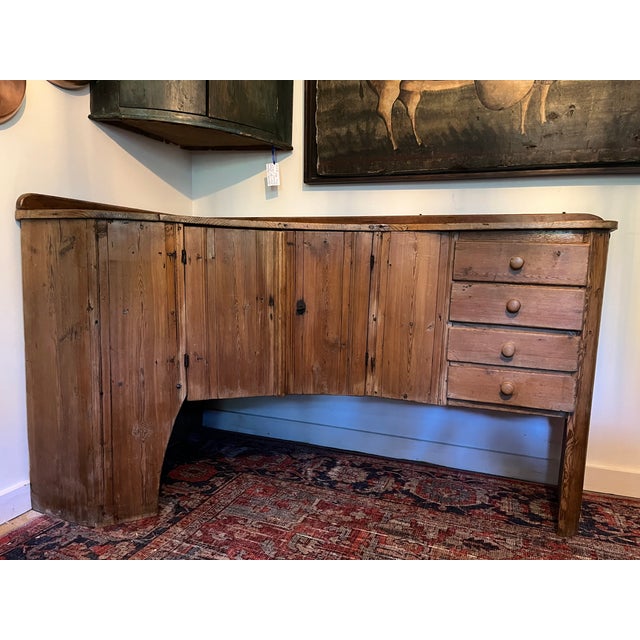 Wonderfully primitive Danish server with a light pine finish that would warm and bring whimsey and a sense of the past...