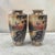 A refined pair of antique Nippon porcelain vases, produced for export during the early 20th century. Each faceted form is...