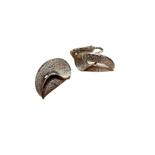 Vintage Coro Silver Tone Clip on Earrings Pair Polished detail with folded textured design. Signed Coro Excellent...