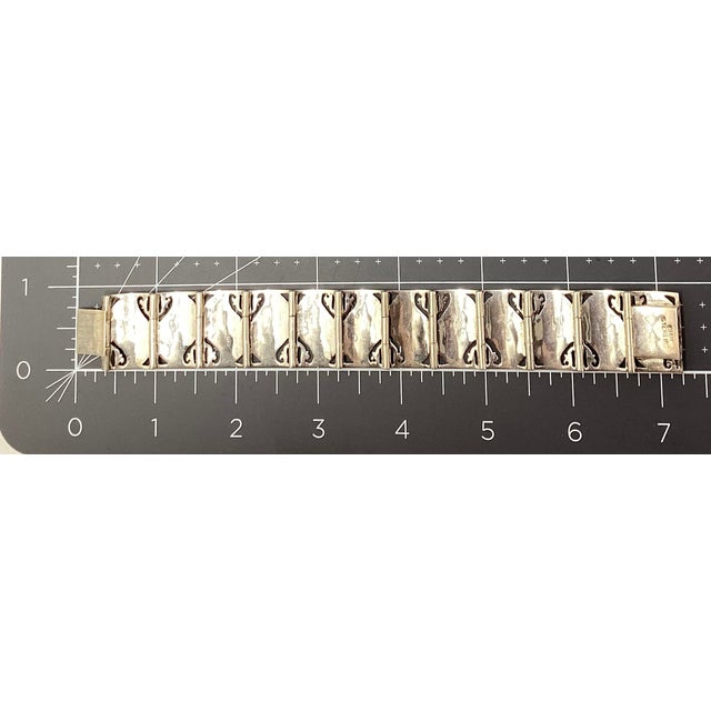 This is a Vintage Marked Siam (Thailand) Sterling Silver Bracelet linked with rectangular in shape engraved nielloware...
