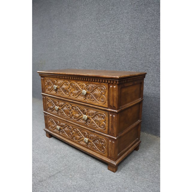 This elegant Henredon commode is crafted in solid carved oak and reflects classic French provincial and Louis XV–inspired...