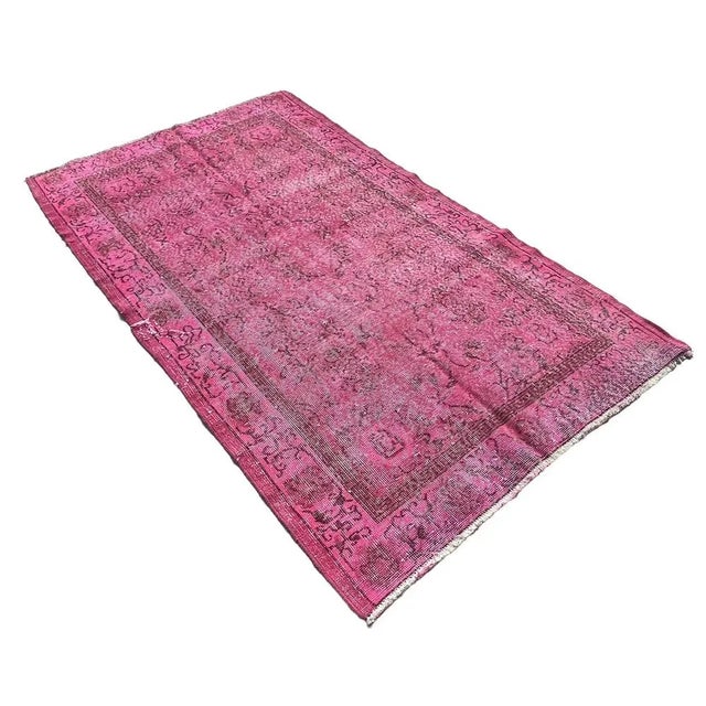 The Distressed Turkish Rug is a handmade vintage piece from the 1960s that measures 213 x 121 cm. It is made from a...