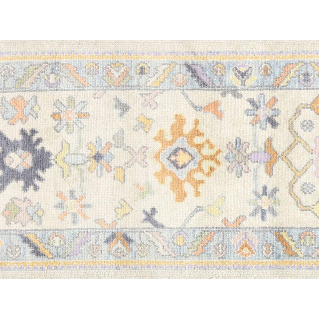 This Vintage Turkish Oushak Rug is a handwoven masterpiece from Western Turkey, measuring 2'9" x 10'3". Oushak has been...