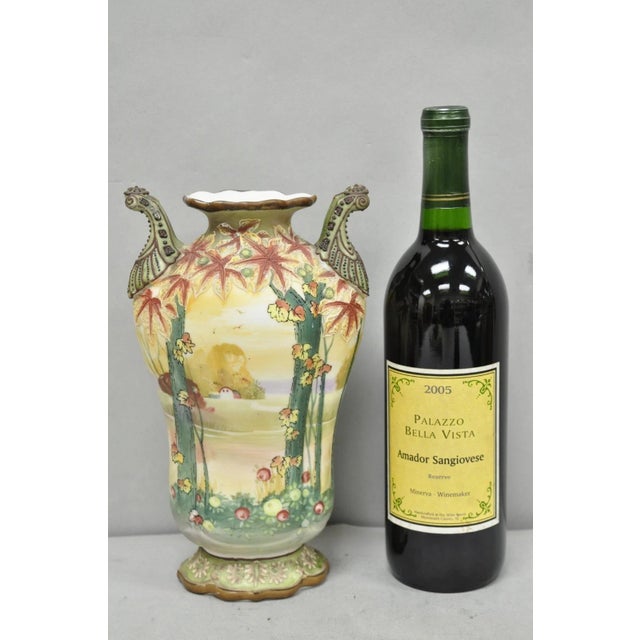 Antique Nippon Hand Painted Porcelain Moriage Twin Handle Countryside Scene Vase. Circa Early 20th Century. Measurements:...