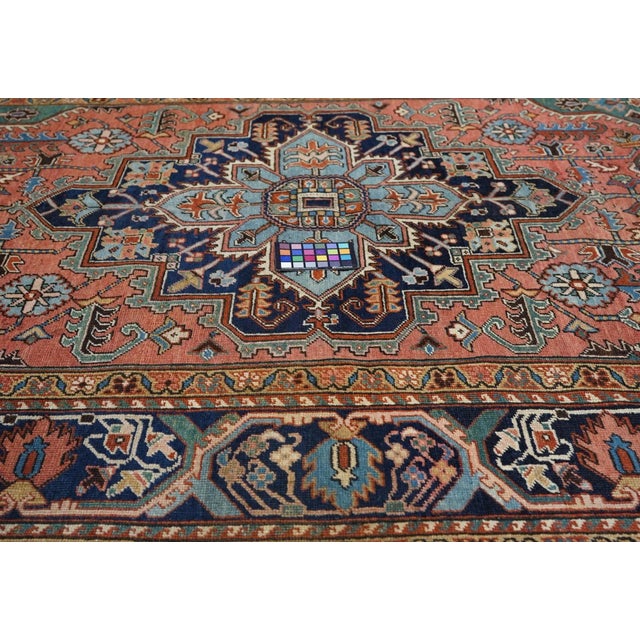 The delightful moss green field slides discreetly along the sides and expands to fringed conjoint corners, while the coral...