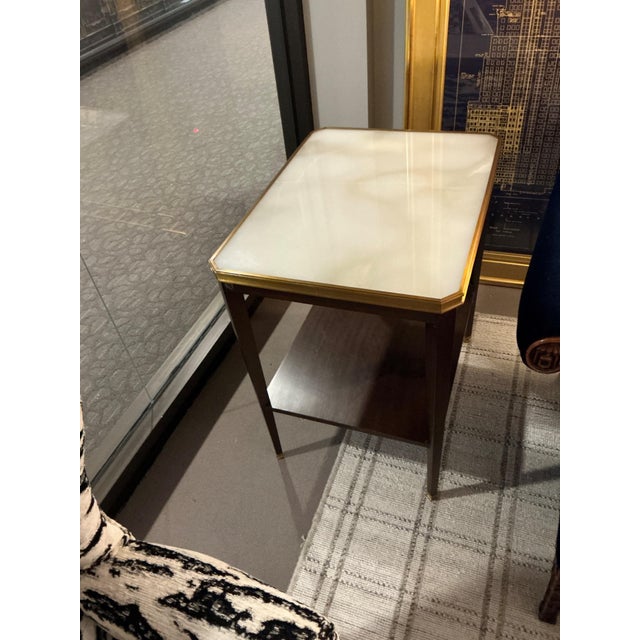 Two Tier Hickory Chair Table with beveled onyx top framed in a warm brass trim with dark legs and brass ferels.