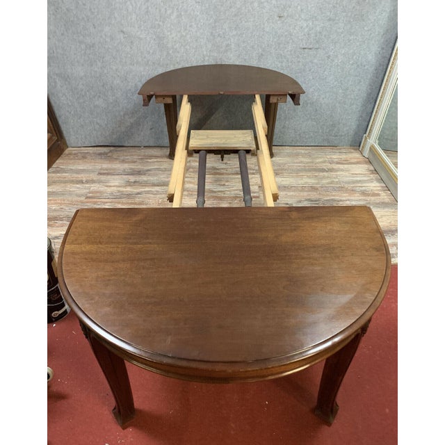 Based on the work of majorelle: a very important art nouveau mahogany extension table, circa 1900 top with a raised apron...