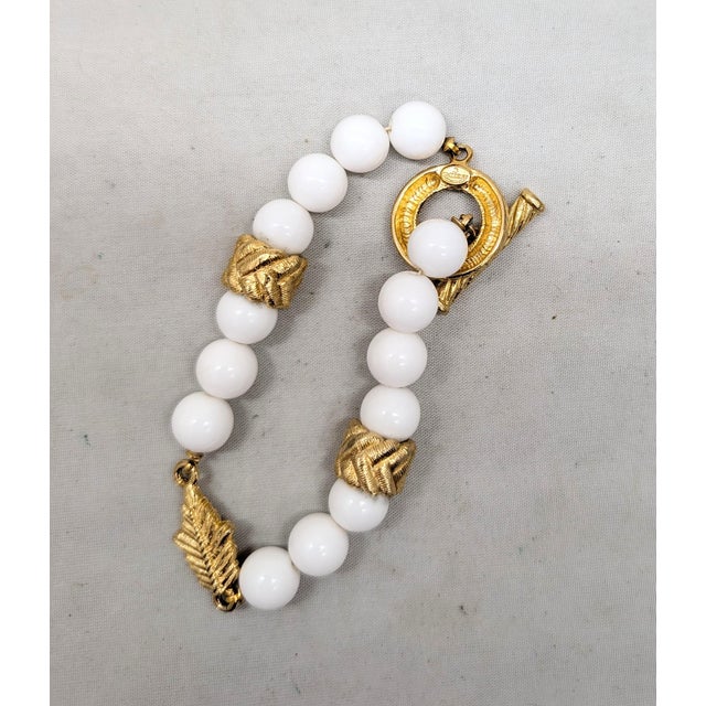 Modern Vintage 1980s Signed Givenchy Goldtone & White Resin Leaf Toggle Bracelet For Sale - Image 3 of 8